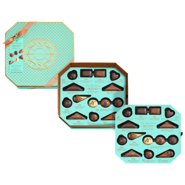 An octagonal turquoise Neuhaus gift box opened to show two layers of assorted pralines, seen from above