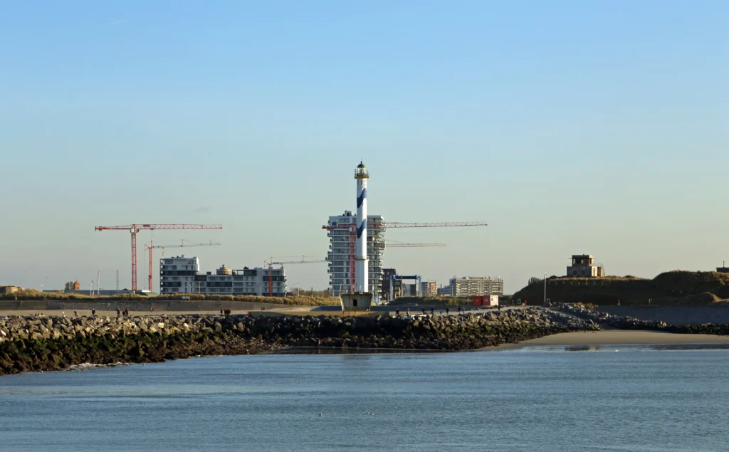 Ostend's Lange Nelle lighthouse, a tall white tower on the east bank of the harbour