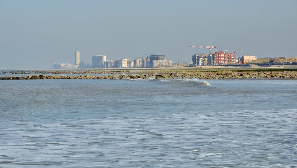 Ostend's seafront skyline of apartment blocks rising behind the wide Groot Strand beach